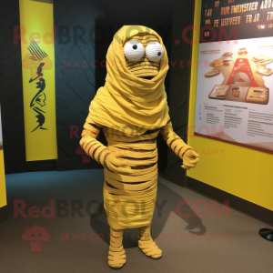 Yellow Mummy mascot costume character dressed with a Cover-up and Shoe clips