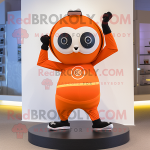 Orange Camera mascot costume character dressed with a Yoga Pants and Rings