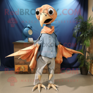 Peach Dimorphodon mascot costume character dressed with a Chambray Shirt and Shawl pins