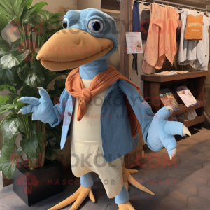 Peach Dimorphodon mascot costume character dressed with a Chambray Shirt and Shawl pins