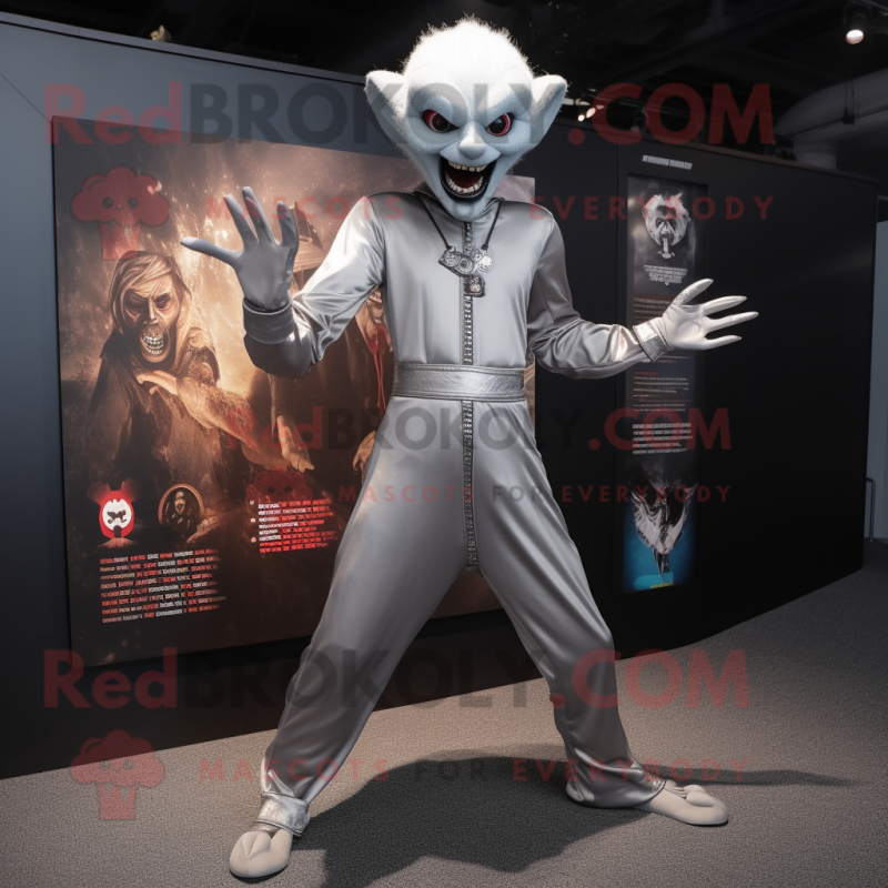 Silver Vampire mascot costume character dressed with a Jumpsuit and Keychains Silver Vampire mascot costume character dressed with a Jumpsuit and Keychains