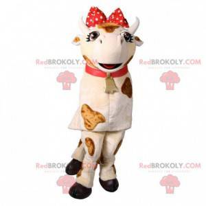 Mascotte mucca bianca e marrone con un fiocco rosso -