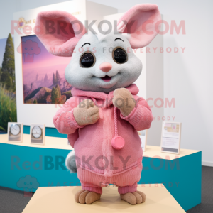 Pink Chinchilla mascot costume character dressed with a Sweater and Rings