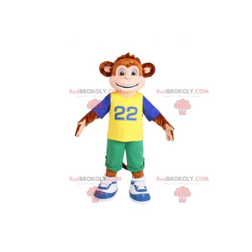 Macaco mascote marrom vestido com uma roupa colorida -