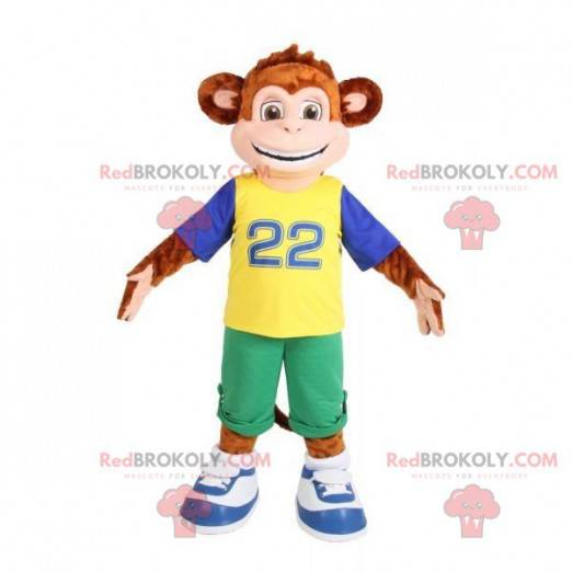 Mascotte de singe marron habillé d'une tenue colorée -