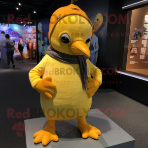 Yellow Penguin mascot costume character dressed with a Rash Guard and Beanies