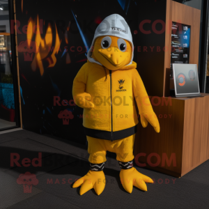 Yellow Penguin mascot costume character dressed with a Rash Guard and Beanies