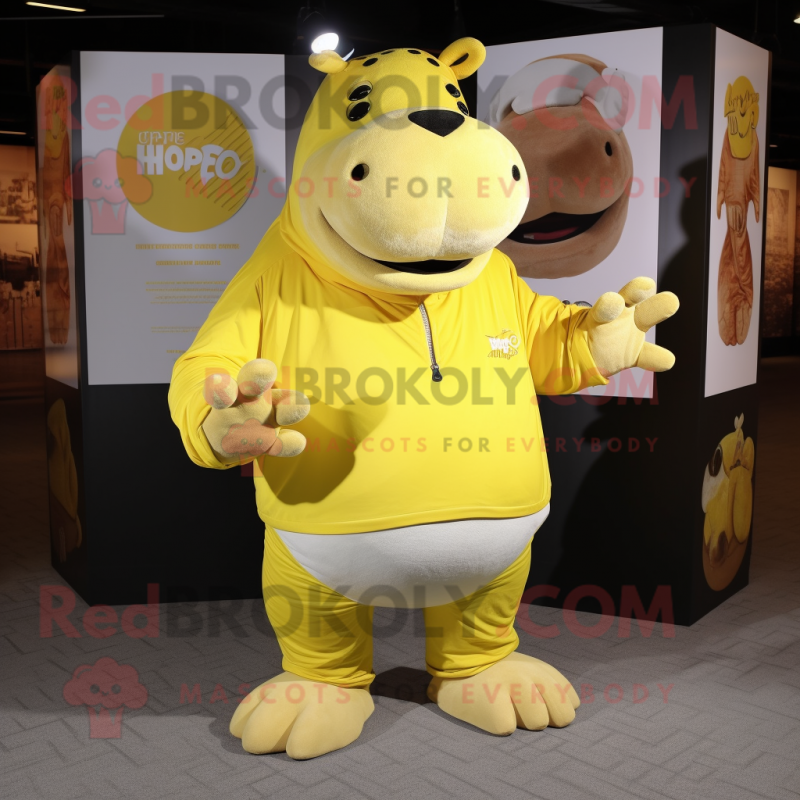 Yellow Hippopotamus mascot costume character dressed with a Henley Tee and Rings