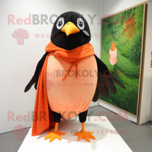Peach Blackbird mascot costume character dressed with a Jumpsuit and Shawls
