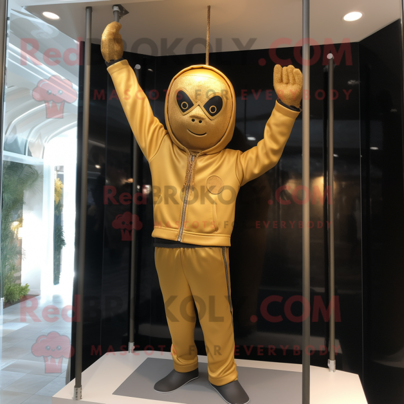 Gold Trapeze Artist mascot costume character dressed with a Sweatshirt and Gloves Gold Trapeze Artist mascot costume character dressed with a Sweatshirt and Gloves