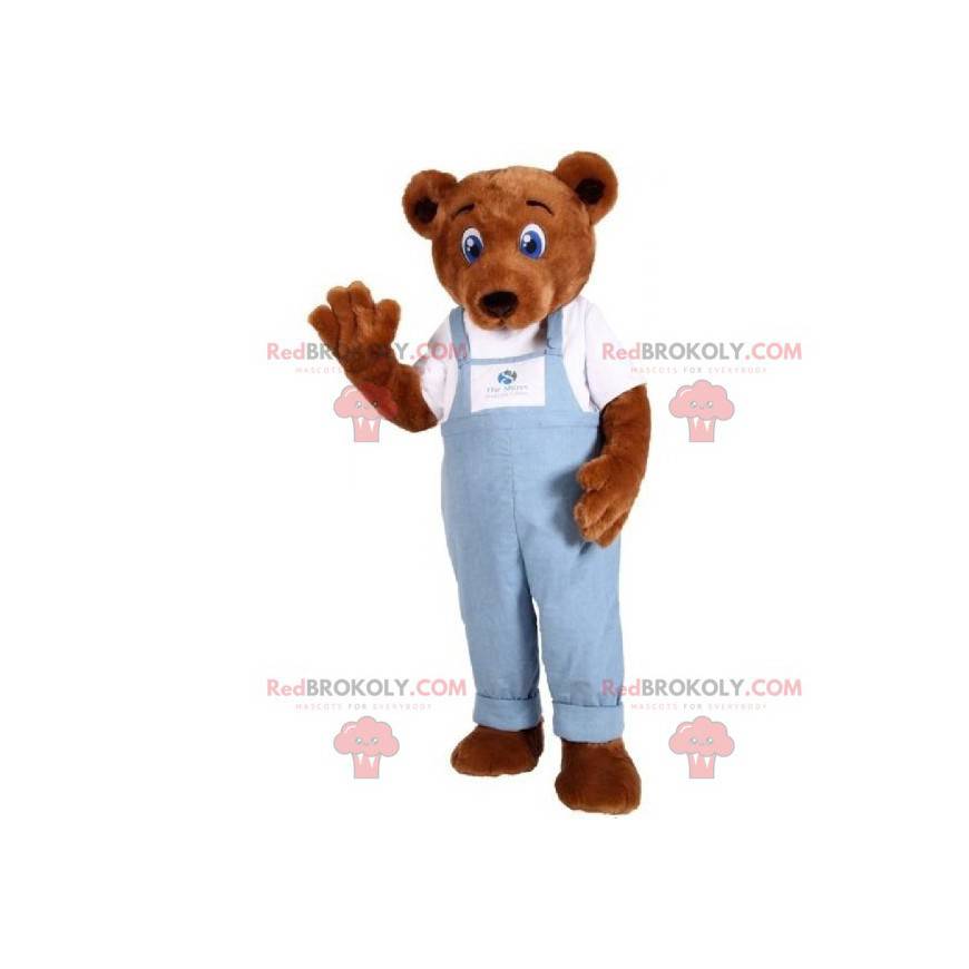 Mascota de peluche marrón vestida con un mono de mezclilla - Mascota de peluche marrón vestida con un mono de mezclilla -