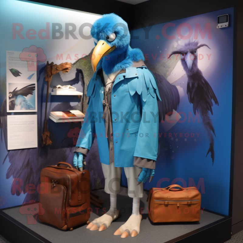 Blue Vulture mascot costume character dressed with a Raincoat and Briefcases Blue Vulture mascot costume character dressed with a Raincoat and Briefcases
