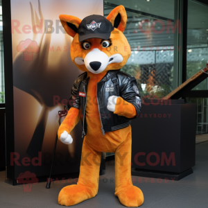 Orange Dingo mascot costume character dressed with a Leather Jacket and Berets