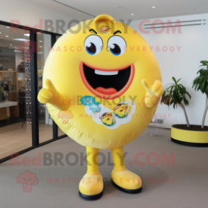 Yellow Donut mascot costume character dressed with a Rash Guard and Lapel pins