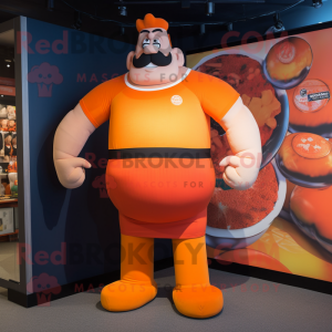 Orange Strongman mascot costume character dressed with a Polo Shirt and Headbands