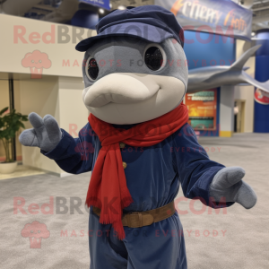 Navy Swordfish mascot costume character dressed with a Corduroy Pants and Scarves