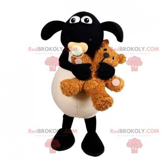 Black and white lamb mascot with a pacifier in the mouth -