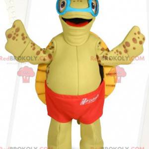 Mascotte de tortue avec des lunettes et un short de bain -