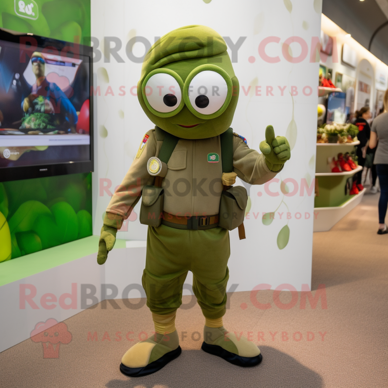 Olive Soldier mascot costume character dressed with a Capri Pants and Smartwatches