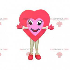 Gigantisk rød og rosa hjertemaskot. Romantisk maskot -