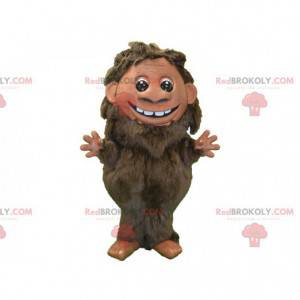 Brun hårig maskot. Förhistorisk manmaskot - Redbrokoly.com