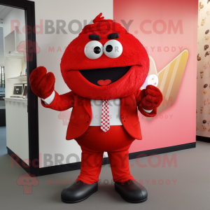 Red Cupcake mascot costume character dressed with a Suit Jacket and Clutch bags