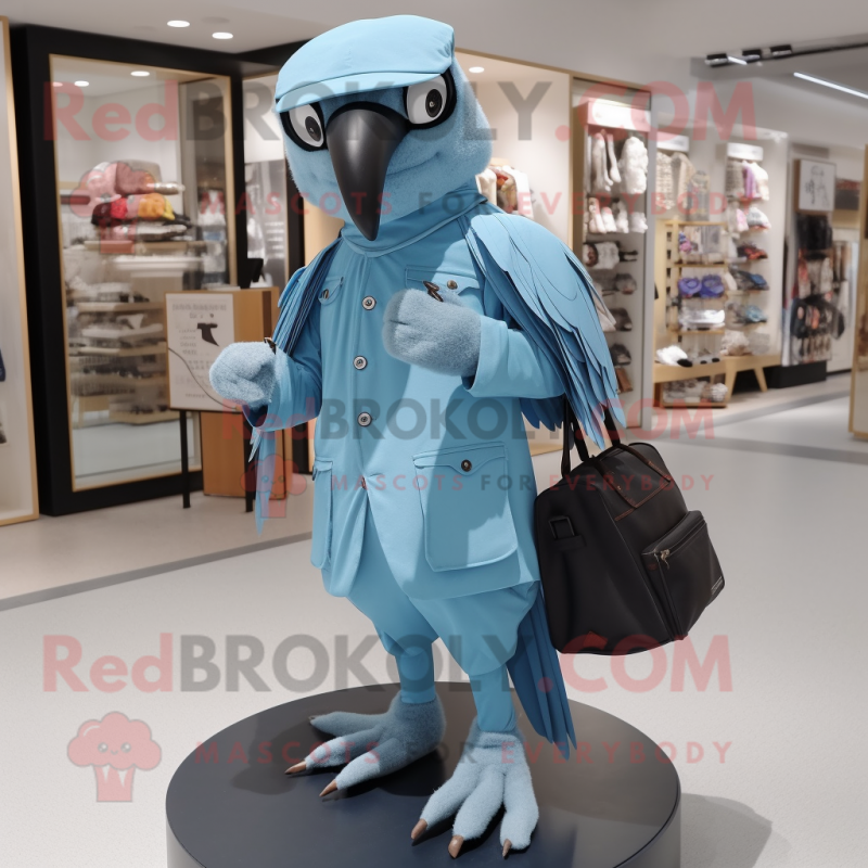 Sky Blue Crow mascot costume character dressed with a Poplin Shirt and Messenger bags