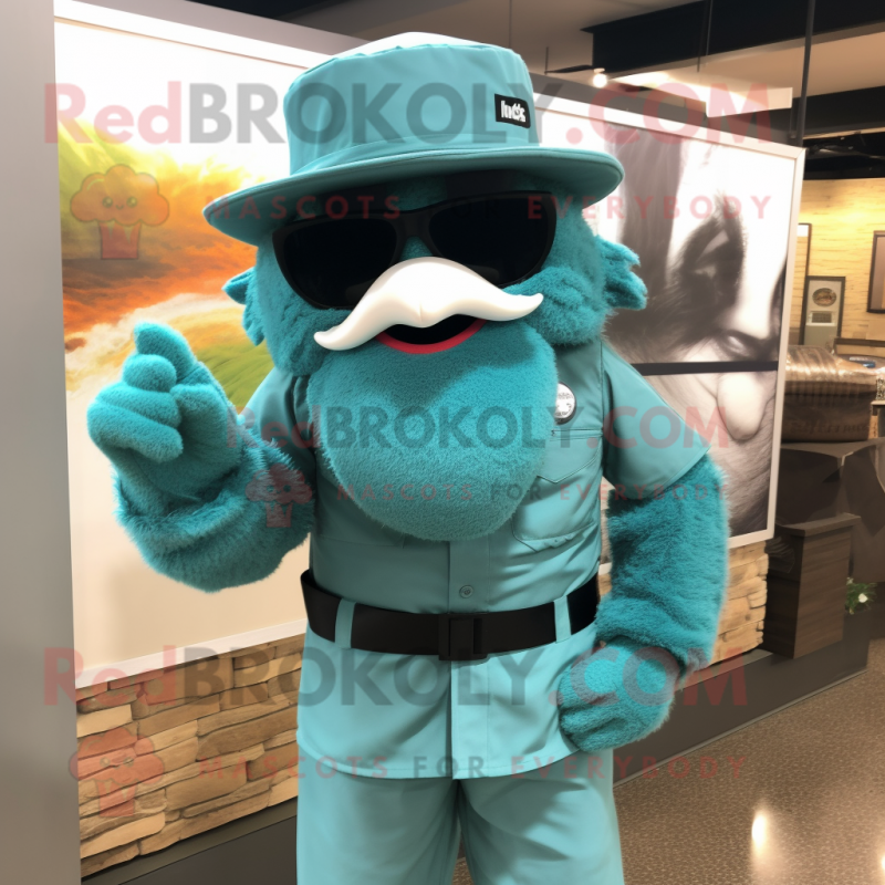 Turquoise Sniper mascot costume character dressed with a Dress Shirt and Sunglasses Turquoise Sniper mascot costume character dressed with a Dress Shirt and Sunglasses
