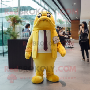 Yellow Walrus mascot costume character dressed with a Suit Pants and Keychains