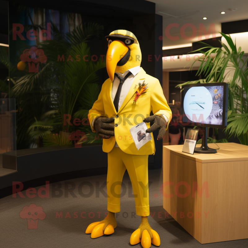 Yellow Toucan mascot costume character dressed with a Blazer and Digital watches