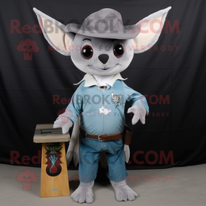 Silver Fruit Bat mascot costume character dressed with a Bootcut Jeans and Hat pins