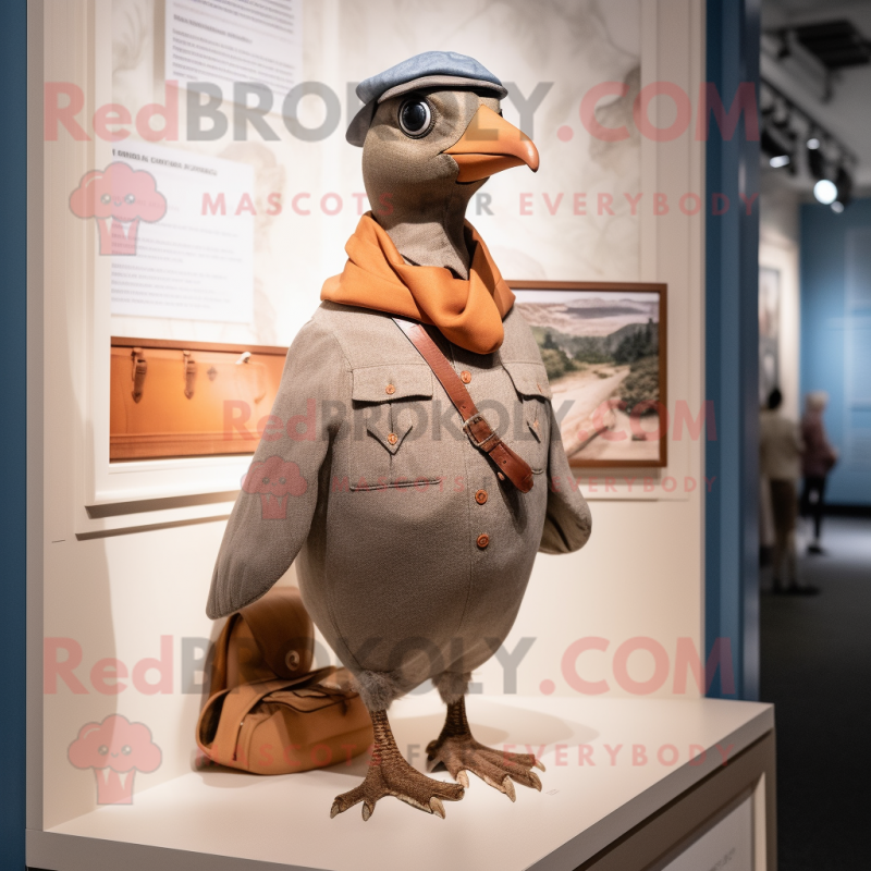 Tan Passenger Pigeon mascot costume character dressed with a Henley Tee and Mittens Tan Passenger Pigeon mascot costume character dressed with a Henley Tee and Mittens