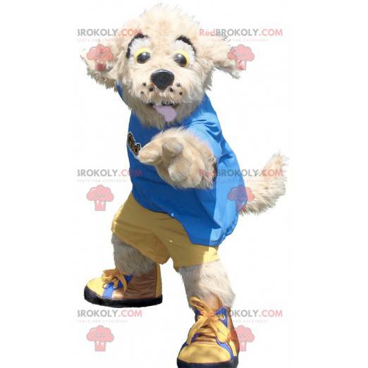 Beżowy pies maskotka w żółto-niebieskim stroju - Redbrokoly.com