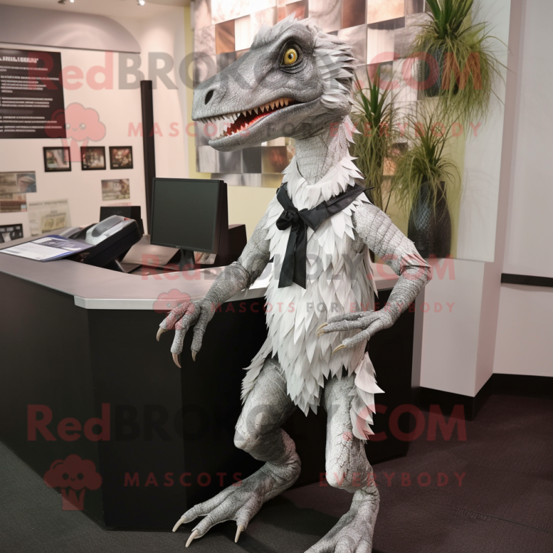 Silver Deinonychus mascot costume character dressed with a Skirt and Ties Silver Deinonychus mascot costume character dressed with a Skirt and Ties