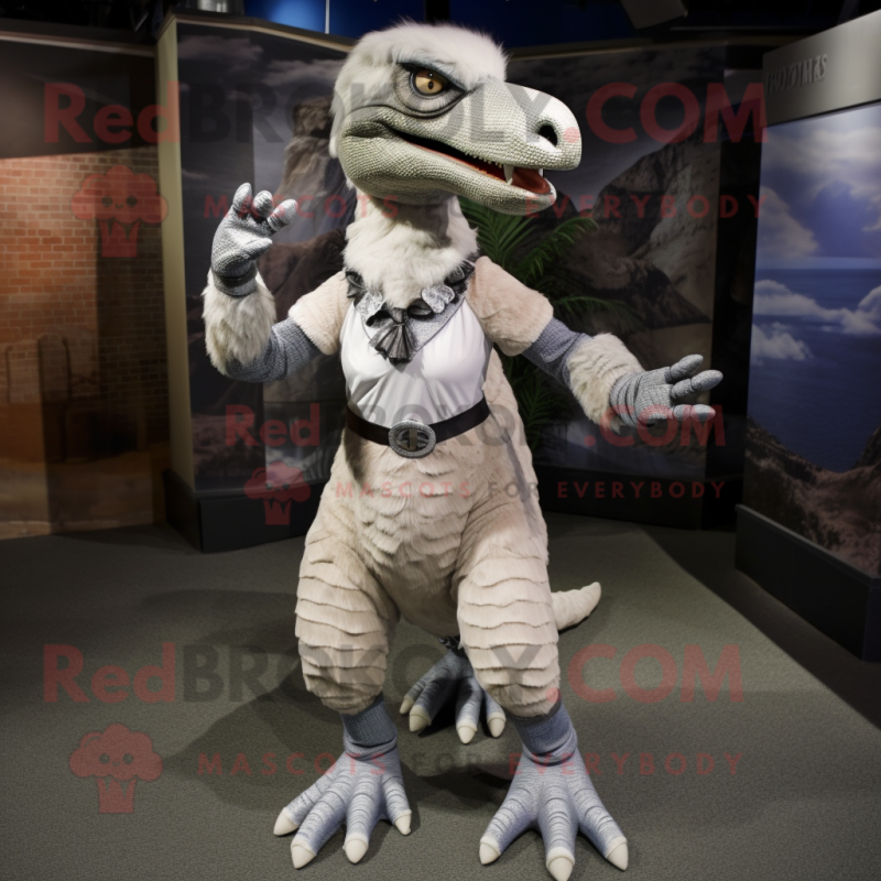 Silver Deinonychus mascot costume character dressed with a Skirt and Ties Silver Deinonychus mascot costume character dressed with a Skirt and Ties