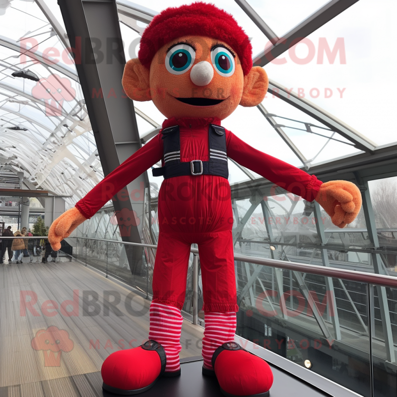 Red Tightrope Walker mascot costume character dressed with a Vest and Scarves