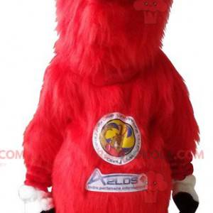 Mascotte Aelos bouc rouge poilu avec de grandes cornes -