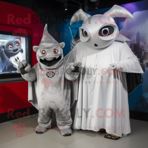 Silver Steak mascot costume character dressed with a Cover-up and Watches