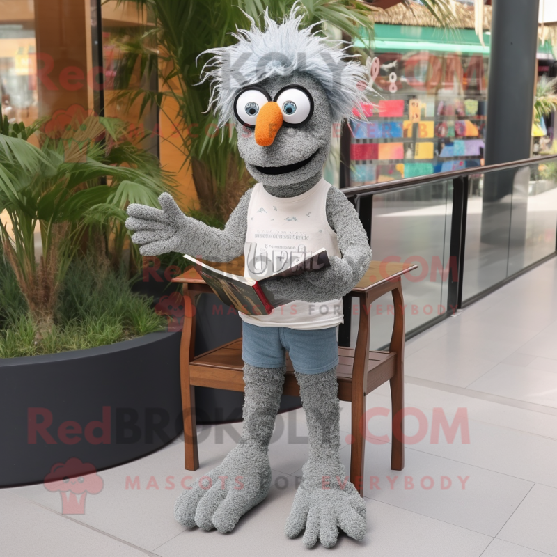 Gray Paella mascot costume character dressed with a Jeans and Reading glasses Gray Paella mascot costume character dressed with a Jeans and Reading glasses
