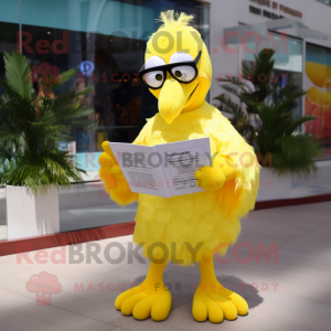 Lemon Yellow Flamingo mascot costume character dressed with a Cover-up and Reading glasses