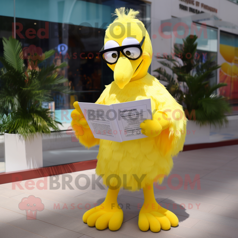 Lemon Yellow Flamingo mascot costume character dressed with a Cover-up and Reading glasses