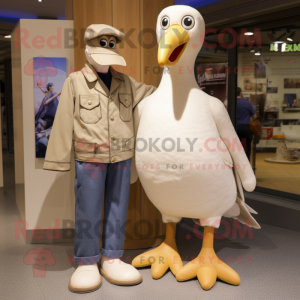 Beige Albatross mascot costume character dressed with a Mom Jeans and Tie pins