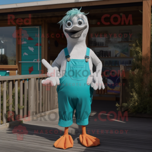 Turquoise Seagull mascot costume character dressed with a Dungarees and Shoe clips