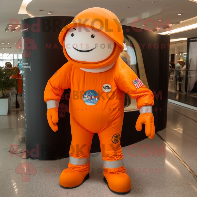 Orange Astronaut mascot costume character dressed with a Skinny Jeans and Hats Orange Astronaut mascot costume character dressed with a Skinny Jeans and Hats