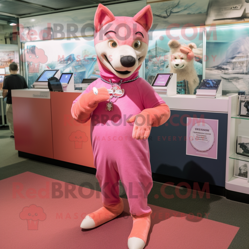 Pink Dingo mascot costume character dressed with a Shift Dress and Bracelet watches Pink Dingo mascot costume character dressed with a Shift Dress and Bracelet watches