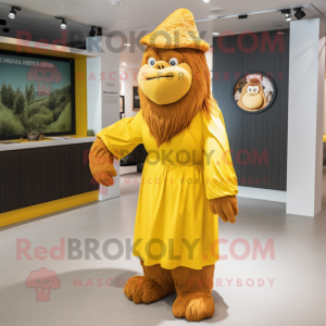 Yellow Orangutan mascot costume character dressed with a Maxi Dress and Caps