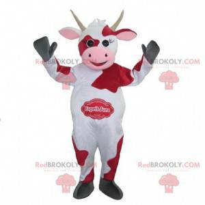 Mascotte de vache blanche et rouge. Mascotte Esprit Jura -