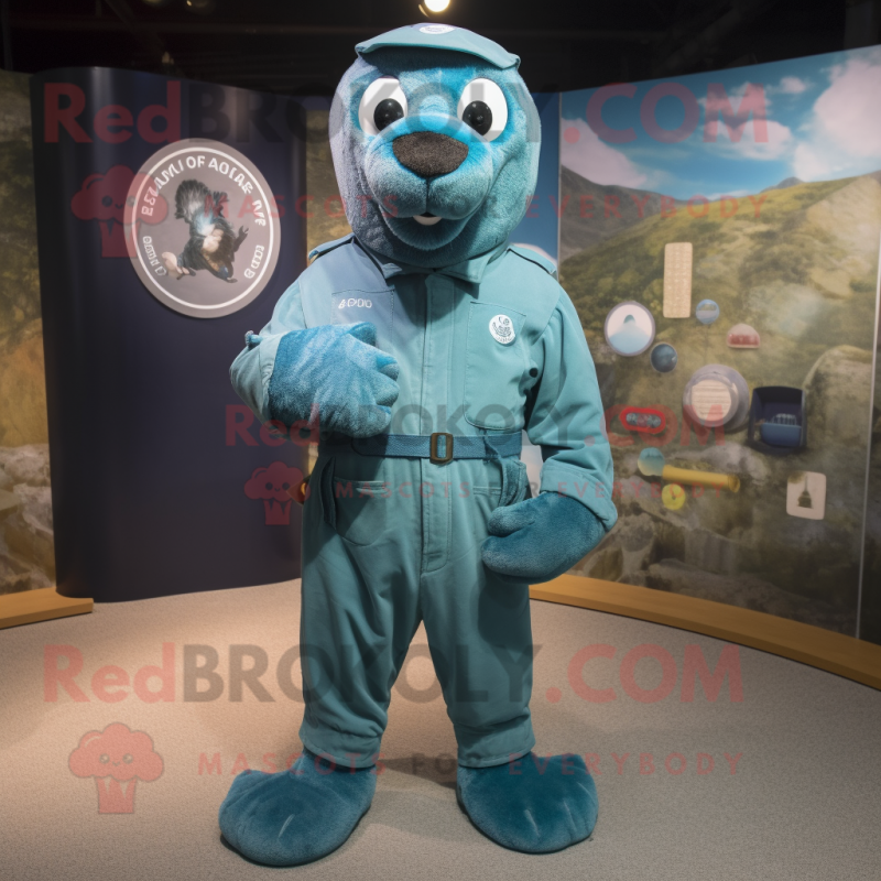 Turquoise Navy Seal mascot costume character dressed with a Dungarees and Tie pins Turquoise Navy Seal mascot costume character dressed with a Dungarees and Tie pins