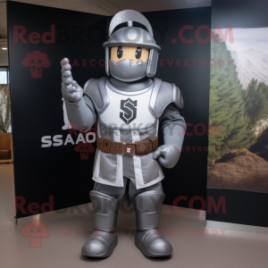 Silver Spartan Soldier mascot costume character dressed with a Baseball Tee and Suspenders