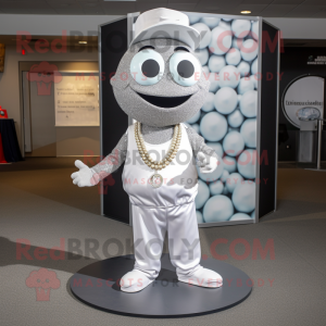 Silver Golf Ball mascot costume character dressed with a Dress Pants and Necklaces